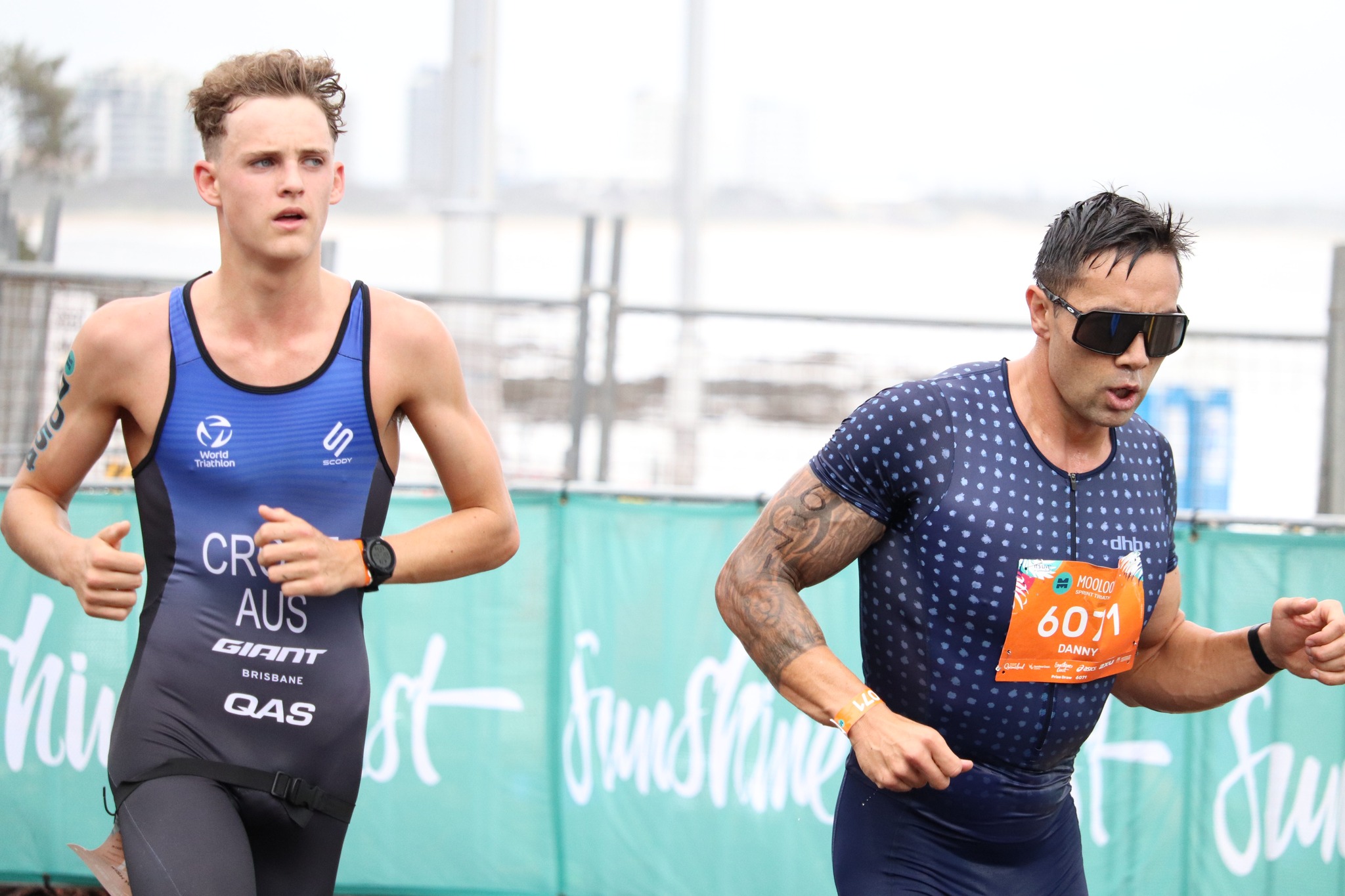 Two male athletes running in the sprint race at Mooloolaba Triathlon. 